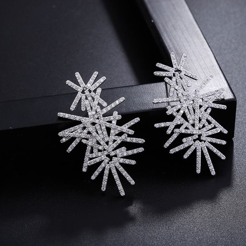 Snowflake shaped exquisite bridal earrings . AAA cubic zirconia 18k gold plated design